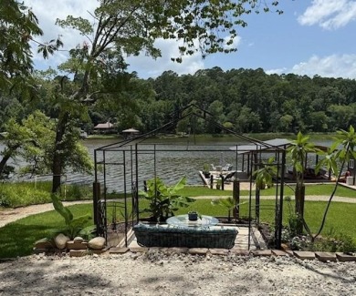 This private and peaceful lakefront home is located in the piney on Pine Dunes Golf Course in Texas - for sale on GolfHomes.com, golf home, golf lot
