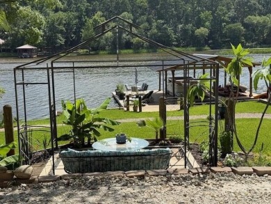 This private and peaceful lakefront home is located in the piney on Pine Dunes Golf Course in Texas - for sale on GolfHomes.com, golf home, golf lot