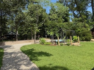 This private and peaceful lakefront home is located in the piney on Pine Dunes Golf Course in Texas - for sale on GolfHomes.com, golf home, golf lot