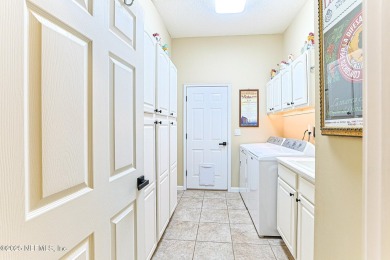 A custom built POOL home on close to 1/2 acre in the wooded area on Magnolia Point Golf and Country Club in Florida - for sale on GolfHomes.com, golf home, golf lot