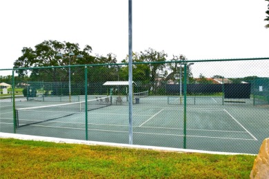 RECENT PRICE REDUCTION!! Looking for a place with tropical on Glen Lakes Country Club in Florida - for sale on GolfHomes.com, golf home, golf lot