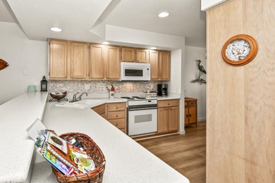 This lower-level condominium is located in Pointe Royale Golf on Pointe Royale Village Country Club in Missouri - for sale on GolfHomes.com, golf home, golf lot