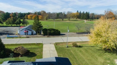 This stunning home situated on a well-manicured 1 acre lot is on Paw Paw Lake Golf Course in Michigan - for sale on GolfHomes.com, golf home, golf lot