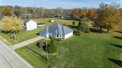 This stunning home situated on a well-manicured 1 acre lot is on Paw Paw Lake Golf Course in Michigan - for sale on GolfHomes.com, golf home, golf lot