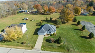 This stunning home situated on a well-manicured 1 acre lot is on Paw Paw Lake Golf Course in Michigan - for sale on GolfHomes.com, golf home, golf lot