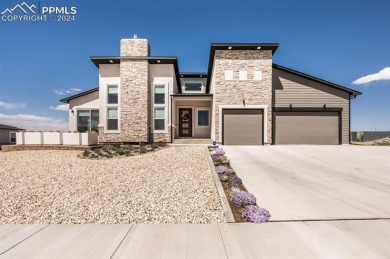 Enjoy breathtaking views of snow-capped Pikes Peak by day and on Walking Stick Golf Course in Colorado - for sale on GolfHomes.com, golf home, golf lot
