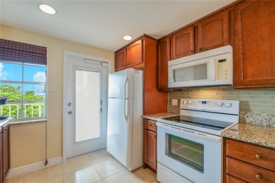 BEAUTIFUL CHARMING 2/2 CONDO WITH PEACEFUL VIEW OF THE LAKE on Palm-Aire Country Club and Resort - Palms in Florida - for sale on GolfHomes.com, golf home, golf lot
