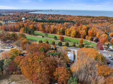 Classic bi-level looking over the 6th fairway of the Charlevoix on Charlevoix Golf Club in Michigan - for sale on GolfHomes.com, golf home, golf lot