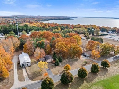 Classic bi-level looking over the 6th fairway of the Charlevoix on Charlevoix Golf Club in Michigan - for sale on GolfHomes.com, golf home, golf lot