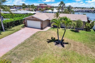 WATERFRONT POOL HOME IN HIGHLY DESIRABLE OAKHURST SHORES! on The Tides Golf Club in Florida - for sale on GolfHomes.com, golf home, golf lot