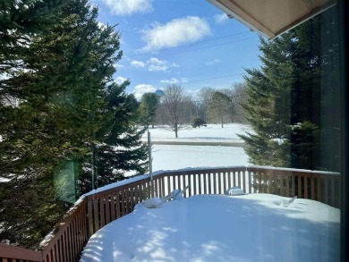 Classic bi-level looking over the 6th fairway of the Charlevoix on Charlevoix Golf Club in Michigan - for sale on GolfHomes.com, golf home, golf lot