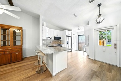 Welcome to this beautifully remodeled villa in the heart of Palm on Highland Lakes Executive Golf Course in Florida - for sale on GolfHomes.com, golf home, golf lot