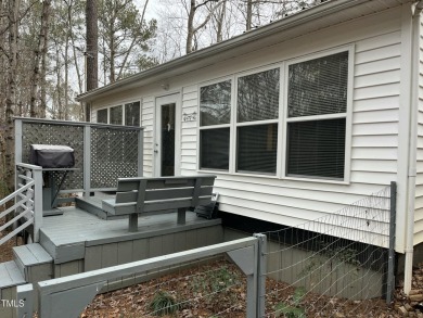 This beautiful 2-bedroom, 2-bathroom home is located in the on River Golf and County Club at Lake Royale in North Carolina - for sale on GolfHomes.com, golf home, golf lot