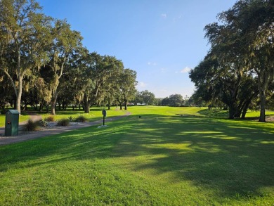 This is a 2006 Palm Harbor split 3-bedroom plan with 1,560' of on Southport Springs Golf Club in Florida - for sale on GolfHomes.com, golf home, golf lot