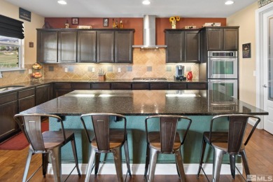 Welcome to this beautifully appointed 4-bedroom, 3-bathroom home on Somersett Country Club in Nevada - for sale on GolfHomes.com, golf home, golf lot