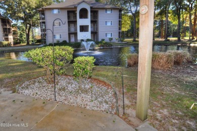 Welcome to this delightful furnished  first-floor 2-bedroom on Oyster Bay Golf Links in North Carolina - for sale on GolfHomes.com, golf home, golf lot