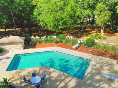 Welcome to this delightful furnished  first-floor 2-bedroom on Oyster Bay Golf Links in North Carolina - for sale on GolfHomes.com, golf home, golf lot