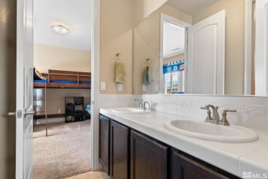 Welcome to this beautifully appointed 4-bedroom, 3-bathroom home on Somersett Country Club in Nevada - for sale on GolfHomes.com, golf home, golf lot