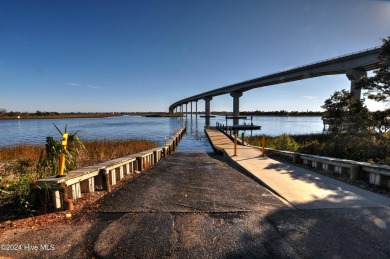 Welcome to this delightful furnished  first-floor 2-bedroom on Oyster Bay Golf Links in North Carolina - for sale on GolfHomes.com, golf home, golf lot