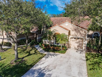 Just steps from the pool, this beautifully maintained 2-bedroom on PGA National Golf Club in Florida - for sale on GolfHomes.com, golf home, golf lot