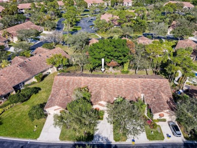 Just steps from the pool, this beautifully maintained 2-bedroom on PGA National Golf Club in Florida - for sale on GolfHomes.com, golf home, golf lot