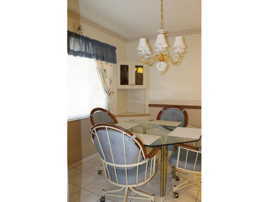 PRICED TO SELL!  It's not very often that a 2/2/2 1794 sq ft htd on Mainlands Golf Club in Florida - for sale on GolfHomes.com, golf home, golf lot