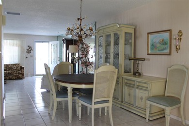 PRICED TO SELL!  It's not very often that a 2/2/2 1794 sq ft htd on Mainlands Golf Club in Florida - for sale on GolfHomes.com, golf home, golf lot