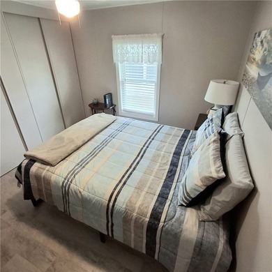 Meticulously maintained home in Barefoot Bay. 2BD/2BA fully on Barefoot Bay Golf Course in Florida - for sale on GolfHomes.com, golf home, golf lot