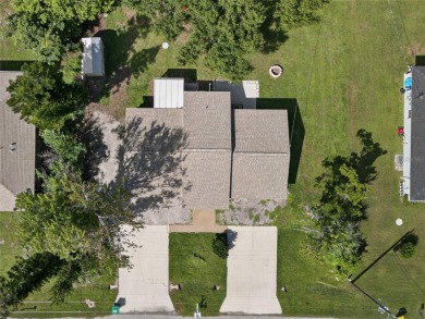 GREAT INCOME OPPORTUNITY IN ENGLEWOOD EAST! Duplex with each on Duffys Golf Center in Florida - for sale on GolfHomes.com, golf home, golf lot