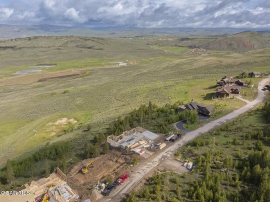 Perched on a scenic ridge with sweeping views of open space on Headwaters Golf Course At Granby Ranch in Colorado - for sale on GolfHomes.com, golf home, golf lot