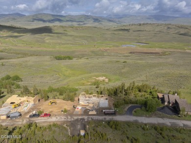 Perched on a scenic ridge with sweeping views of open space on Headwaters Golf Course At Granby Ranch in Colorado - for sale on GolfHomes.com, golf home, golf lot