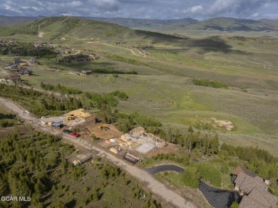 Perched on a scenic ridge with sweeping views of open space on Headwaters Golf Course At Granby Ranch in Colorado - for sale on GolfHomes.com, golf home, golf lot