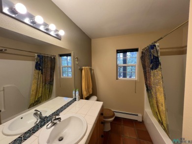 Discover this sweet mountain cabin perfectly situated along the on Pendaries Village Community Assoc. in New Mexico - for sale on GolfHomes.com, golf home, golf lot