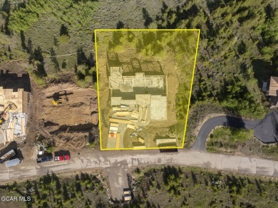 Perched on a scenic ridge with sweeping views of open space on Headwaters Golf Course At Granby Ranch in Colorado - for sale on GolfHomes.com, golf home, golf lot