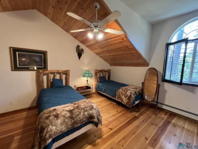 Discover this sweet mountain cabin perfectly situated along the on Pendaries Village Community Assoc. in New Mexico - for sale on GolfHomes.com, golf home, golf lot