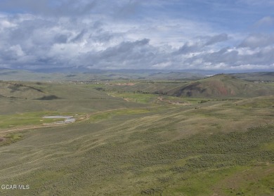 Perched on a scenic ridge with sweeping views of open space on Headwaters Golf Course At Granby Ranch in Colorado - for sale on GolfHomes.com, golf home, golf lot