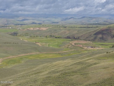 Perched on a scenic ridge with sweeping views of open space on Headwaters Golf Course At Granby Ranch in Colorado - for sale on GolfHomes.com, golf home, golf lot