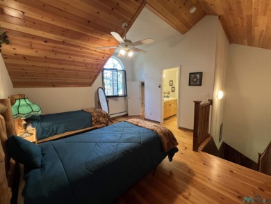Discover this sweet mountain cabin perfectly situated along the on Pendaries Village Community Assoc. in New Mexico - for sale on GolfHomes.com, golf home, golf lot