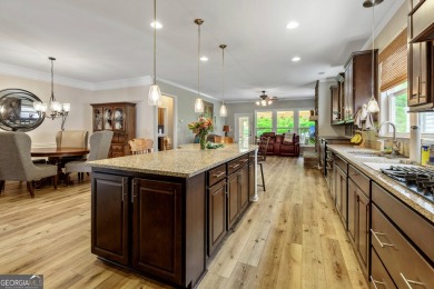 Stunning 3BR, 2 Bath home with large open living spaces on Canongate Golf At Sun City Peachtree in Georgia - for sale on GolfHomes.com, golf home, golf lot