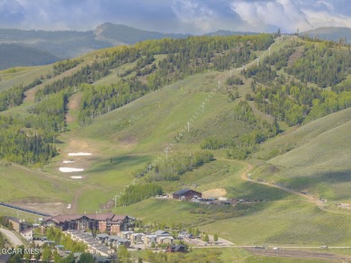 Perched on a scenic ridge with sweeping views of open space on Headwaters Golf Course At Granby Ranch in Colorado - for sale on GolfHomes.com, golf home, golf lot