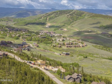 Perched on a scenic ridge with sweeping views of open space on Headwaters Golf Course At Granby Ranch in Colorado - for sale on GolfHomes.com, golf home, golf lot