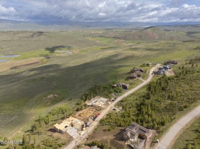 Perched on a scenic ridge with sweeping views of open space on Headwaters Golf Course At Granby Ranch in Colorado - for sale on GolfHomes.com, golf home, golf lot