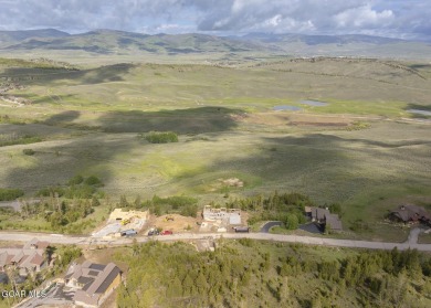 Perched on a scenic ridge with sweeping views of open space on Headwaters Golf Course At Granby Ranch in Colorado - for sale on GolfHomes.com, golf home, golf lot