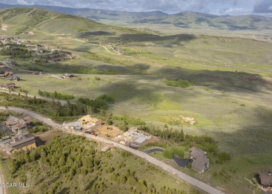 Perched on a scenic ridge with sweeping views of open space on Headwaters Golf Course At Granby Ranch in Colorado - for sale on GolfHomes.com, golf home, golf lot