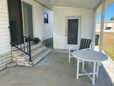 Fully furnished 2/2 home in vibrant 55+ community on leased land on Spanish Lakes Fairways in Florida - for sale on GolfHomes.com, golf home, golf lot