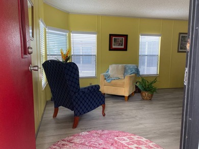 Fully furnished 2/2 home in vibrant 55+ community on leased land on Spanish Lakes Fairways in Florida - for sale on GolfHomes.com, golf home, golf lot