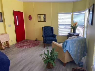 Fully furnished 2/2 home in vibrant 55+ community on leased land on Spanish Lakes Fairways in Florida - for sale on GolfHomes.com, golf home, golf lot