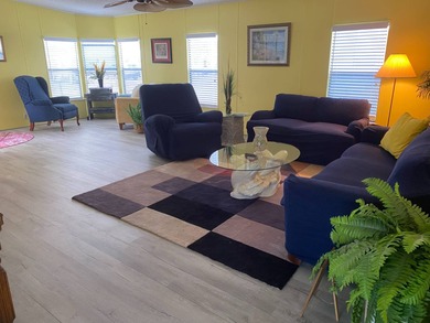 Fully furnished 2/2 home in vibrant 55+ community on leased land on Spanish Lakes Fairways in Florida - for sale on GolfHomes.com, golf home, golf lot