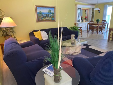 Fully furnished 2/2 home in vibrant 55+ community on leased land on Spanish Lakes Fairways in Florida - for sale on GolfHomes.com, golf home, golf lot