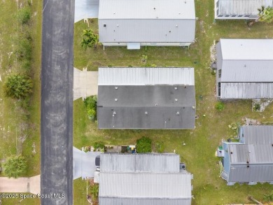 New roof coming; AC is 2018; double driveway. This home is one on Barefoot Bay Golf Course in Florida - for sale on GolfHomes.com, golf home, golf lot